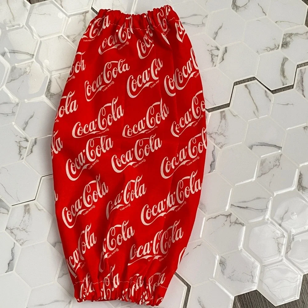 Handmade wall hanging grocery bags organizer and pantry with Coca Cola logo.